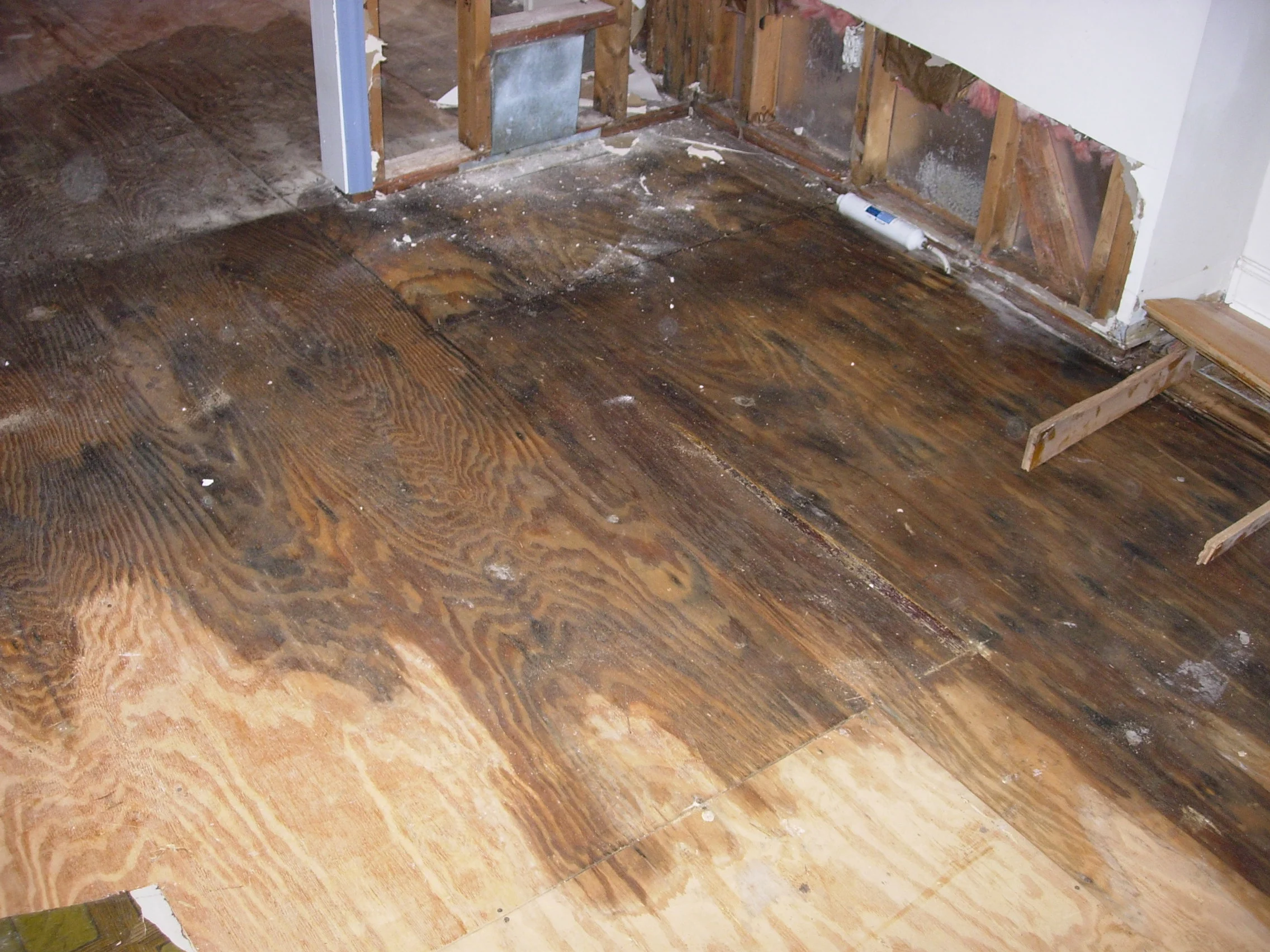 Wooden floor panels damaged by water.
